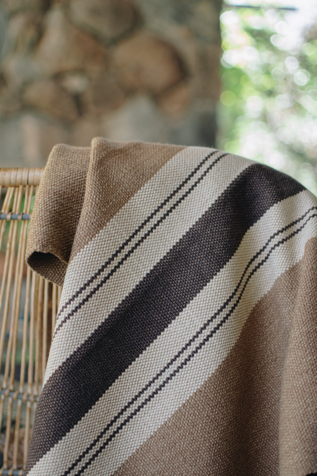 Light brown poncho with three stripes