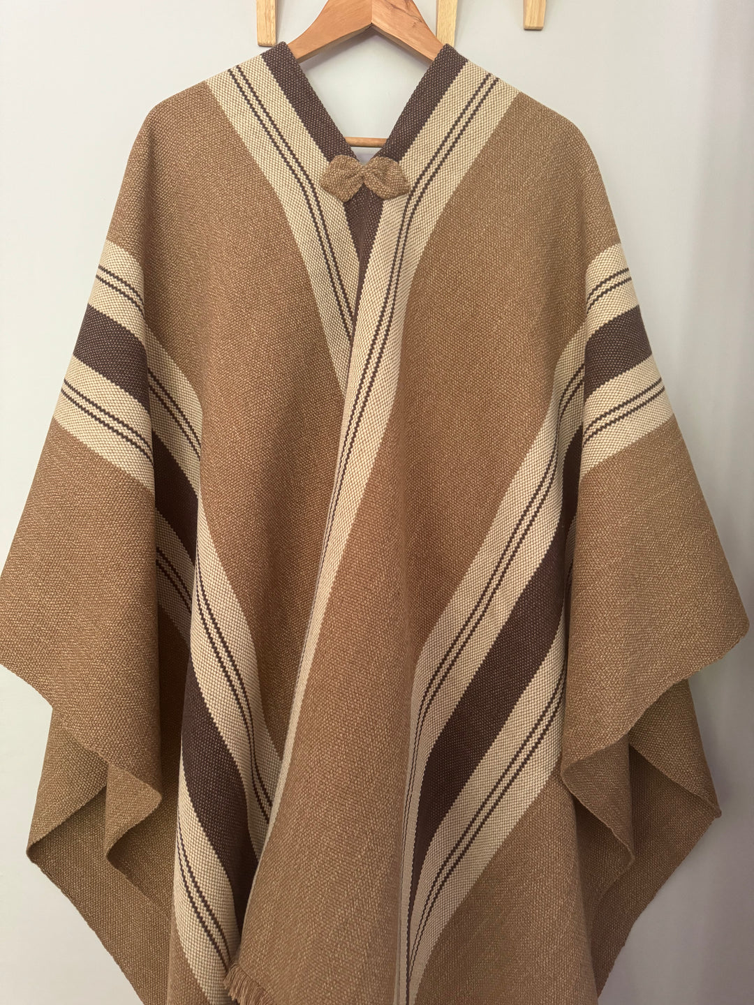 Light brown poncho with three stripes