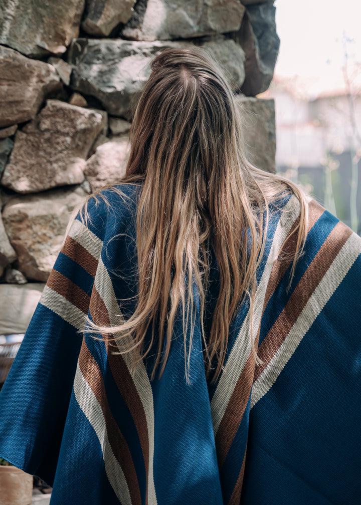 Blue poncho with two stripes