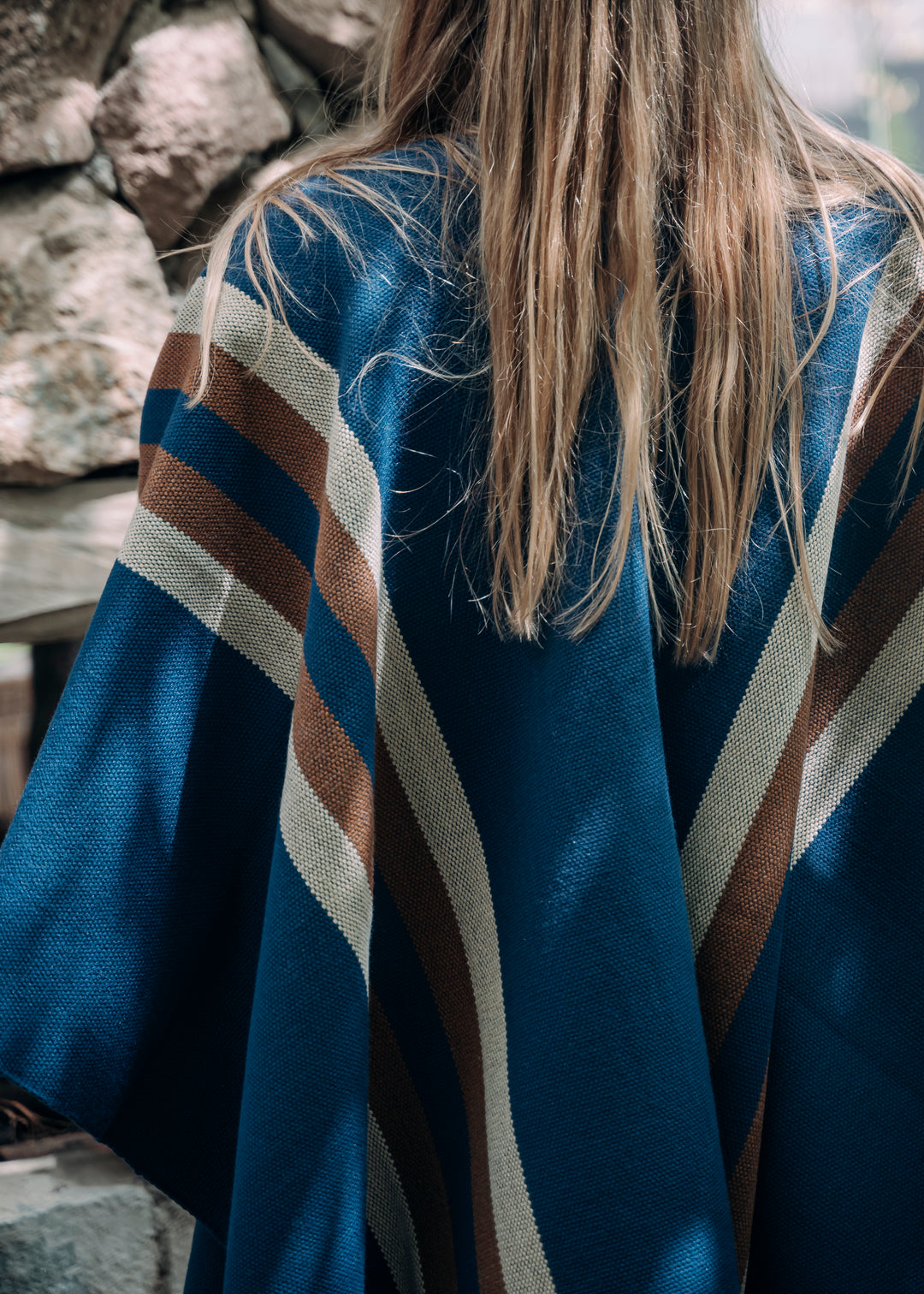 Blue poncho with two stripes
