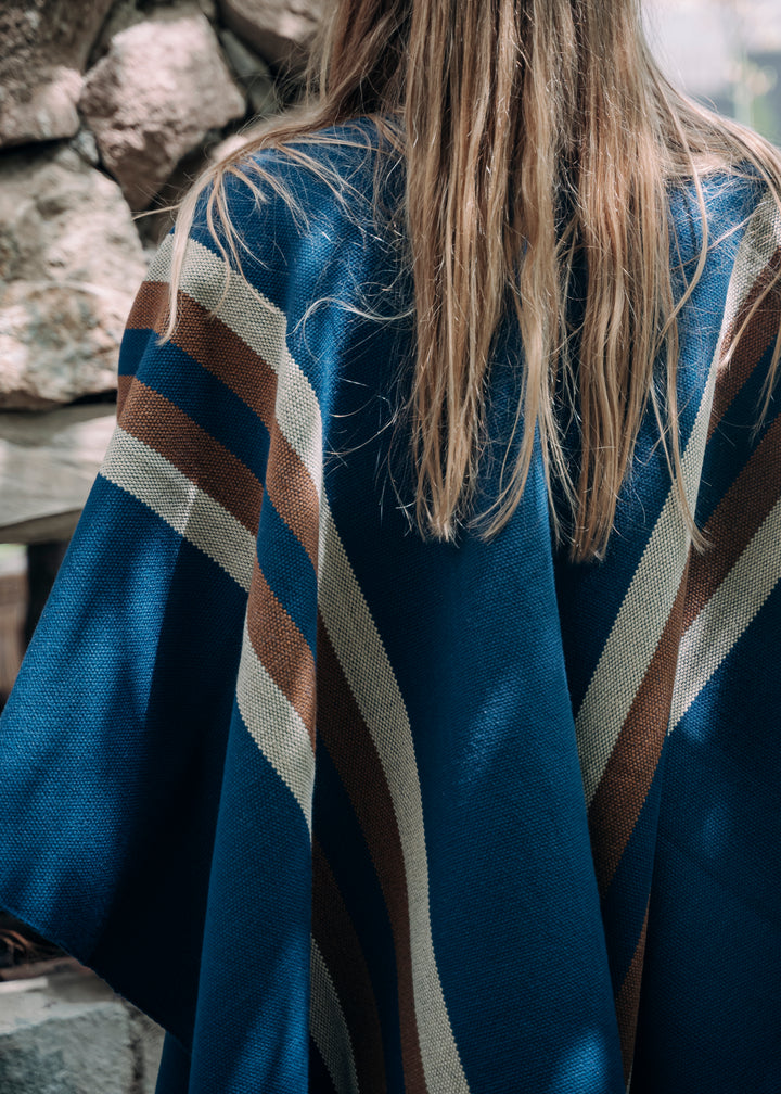 Blue poncho with two stripes