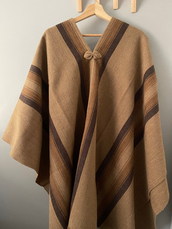 Light brown poncho with three stripes