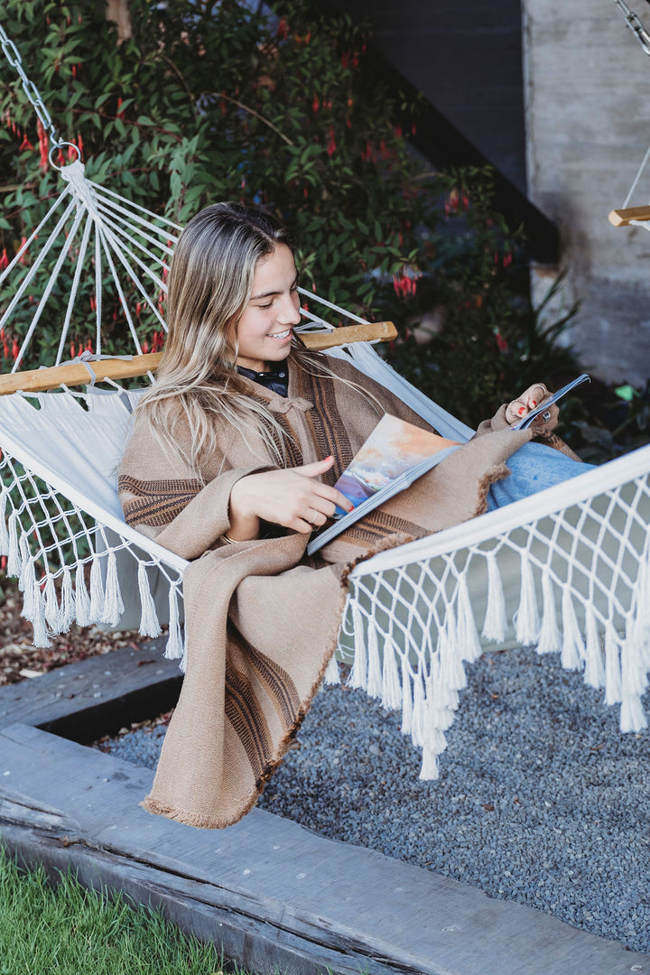 Light brown poncho with three stripes