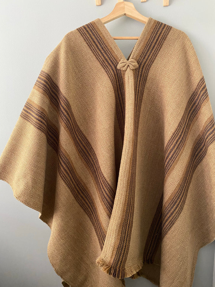 Light brown poncho with three stripes