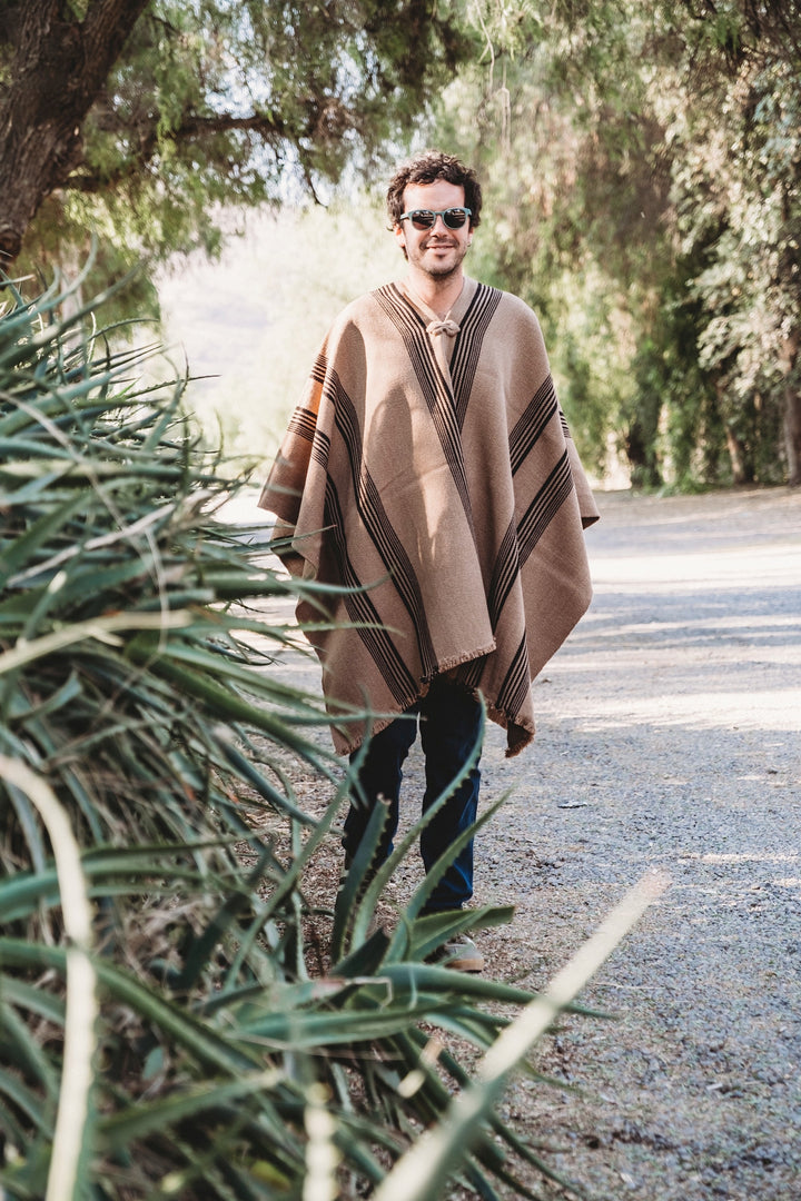 Light brown poncho with three stripes