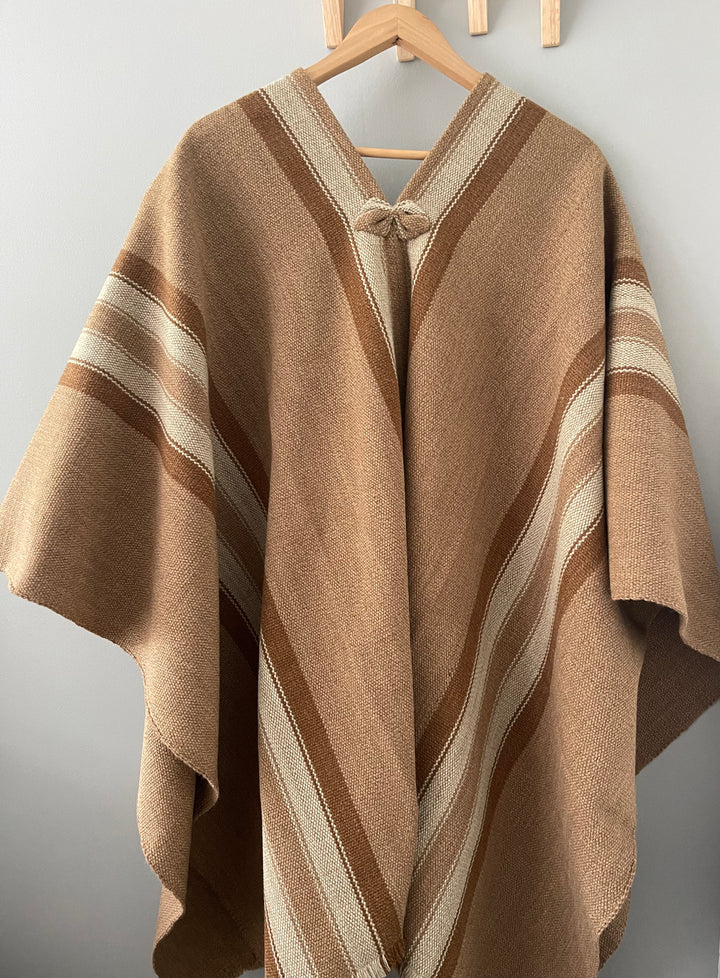 Light brown poncho with three stripes